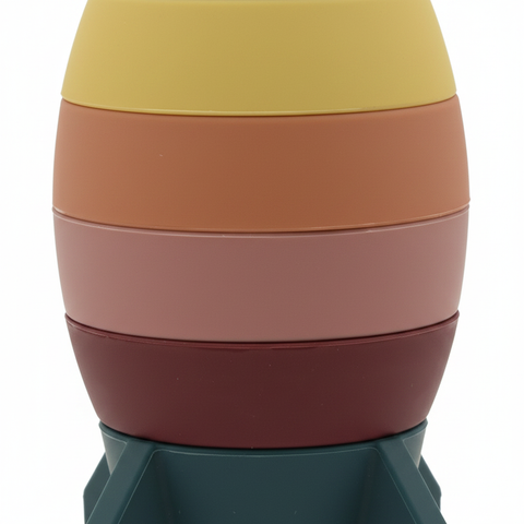 Close-up detail of silicone rocket stacking toy texture and rainbow colors